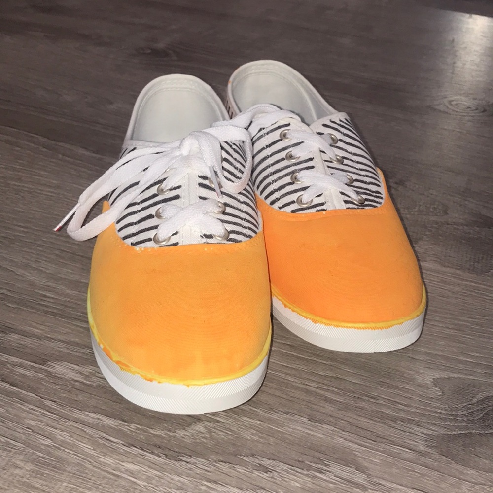 Orange and black striped sneakers.